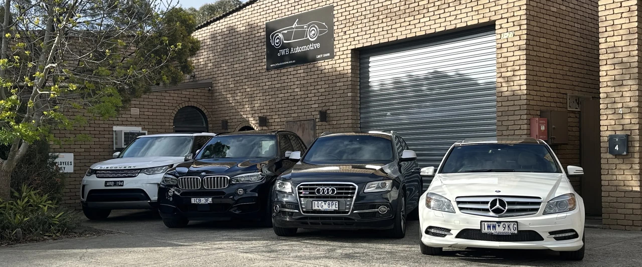 European cars parked outside the JWB Automotive workshop in Clayton
