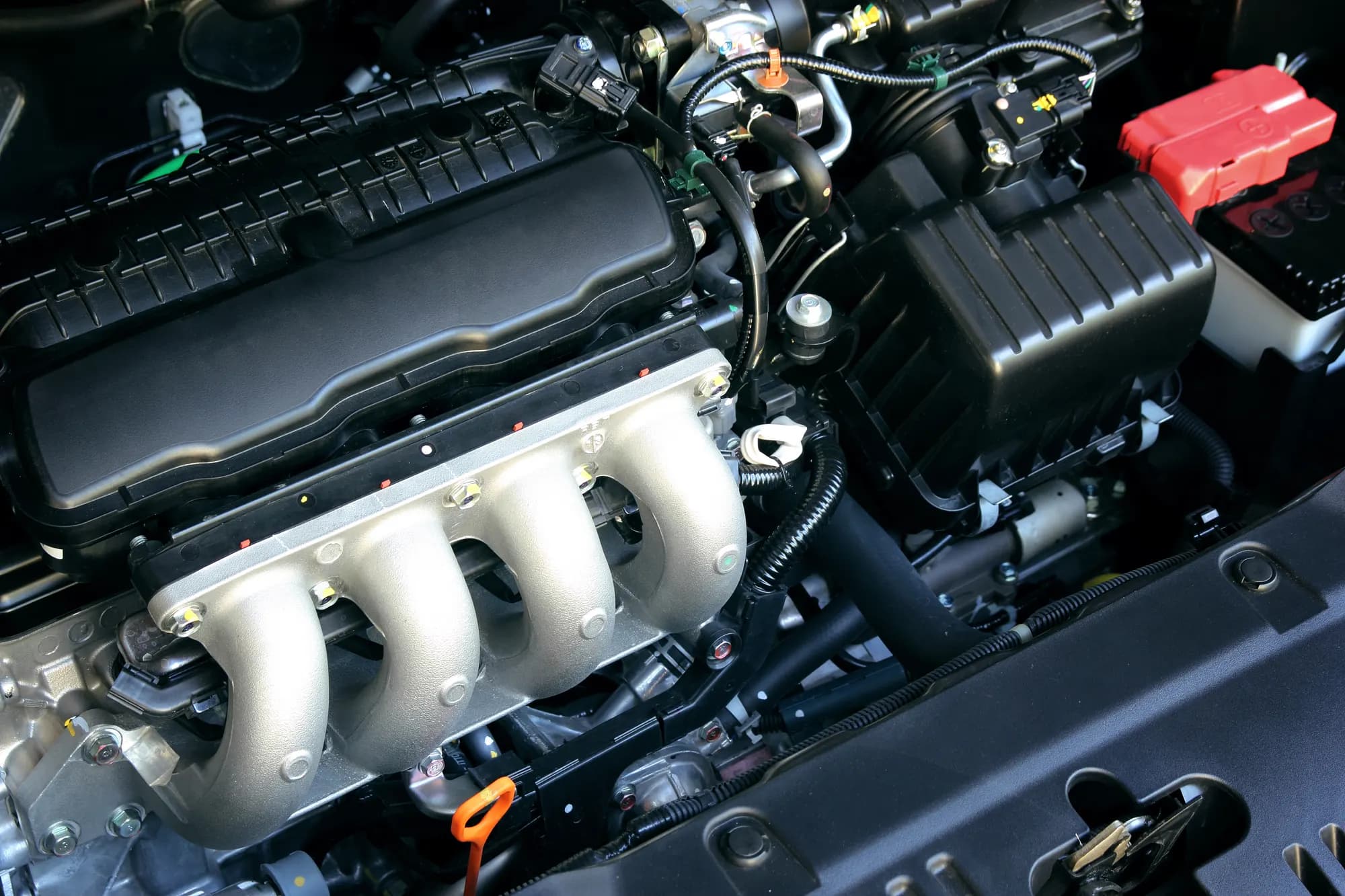 Engine bay of a car with the cooling system and hoses visible, ready for inspection in Clayton