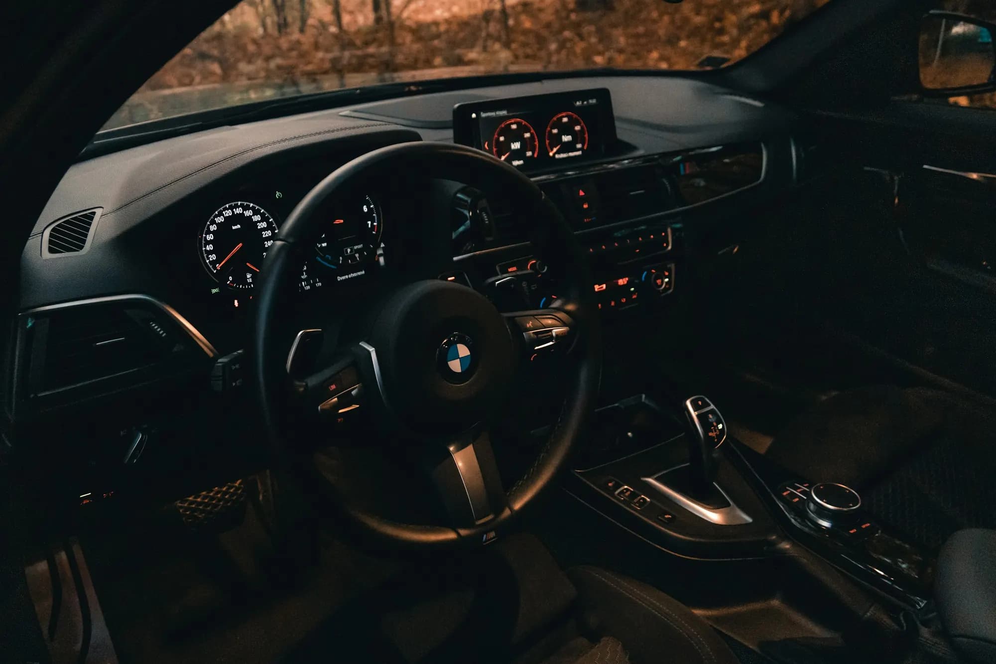 Steering wheel and dashboard of a BMW in for suspension and steering repairs in Clayton